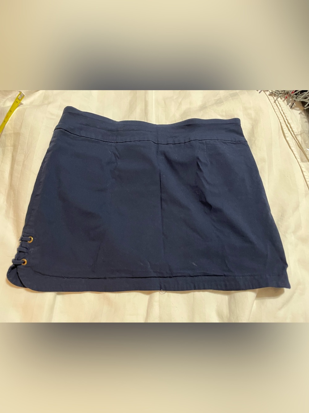 Attyre Navy Mini Skirt with Side Eyelet Detail
16-3